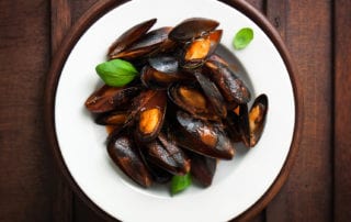 Freshly cooked mussels with a tomato wine sauce
