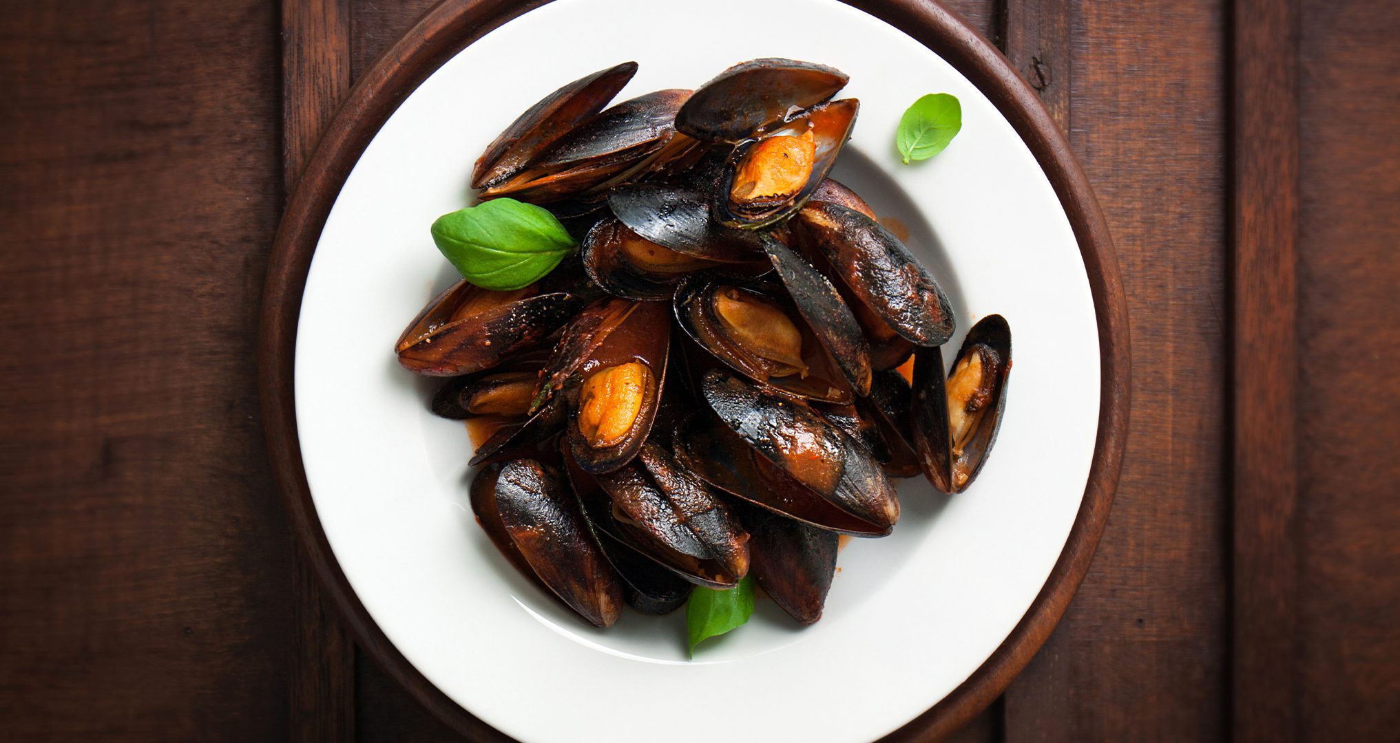 Freshly cooked mussels with a tomato wine sauce